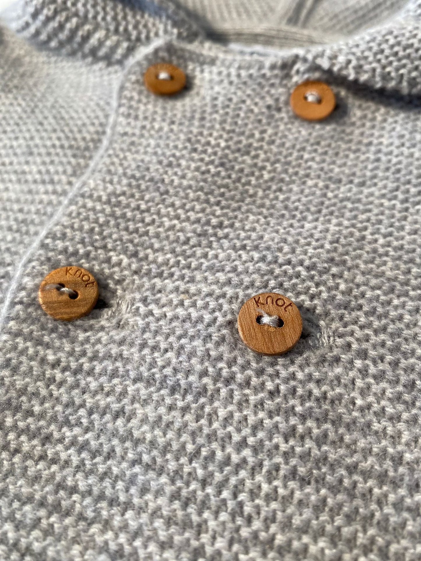 Gilet en maille à capuche